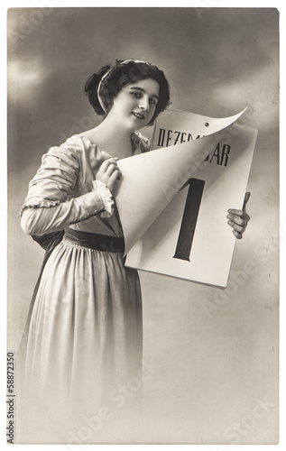 young woman with calendar. antique New Years postcard