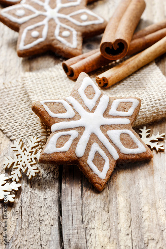 Christmas gingerbread cookies in star shape on rustic wooden