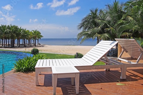 White beach chair beside swimming pool   Thailand