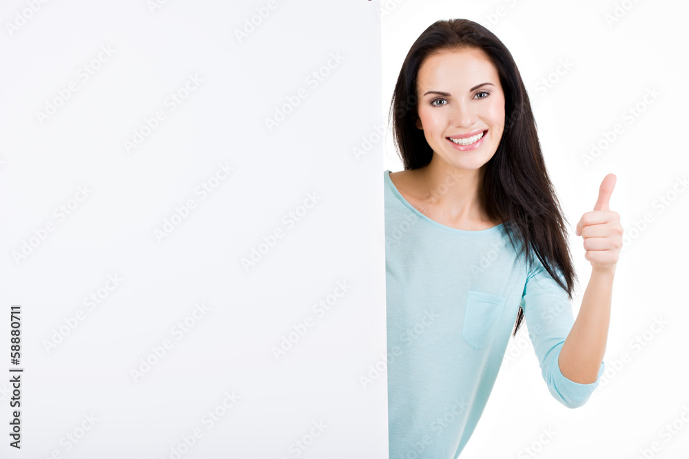 Happy smiling beautiful young woman showing blank signboard Happy smiling beautiful young woman showing blank signboard