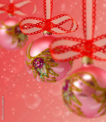image of beautiful pink Christmas balls hanging on ribbons