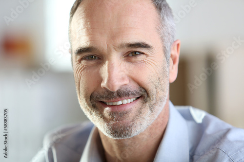 Closeup of handsome senior man with grey hair