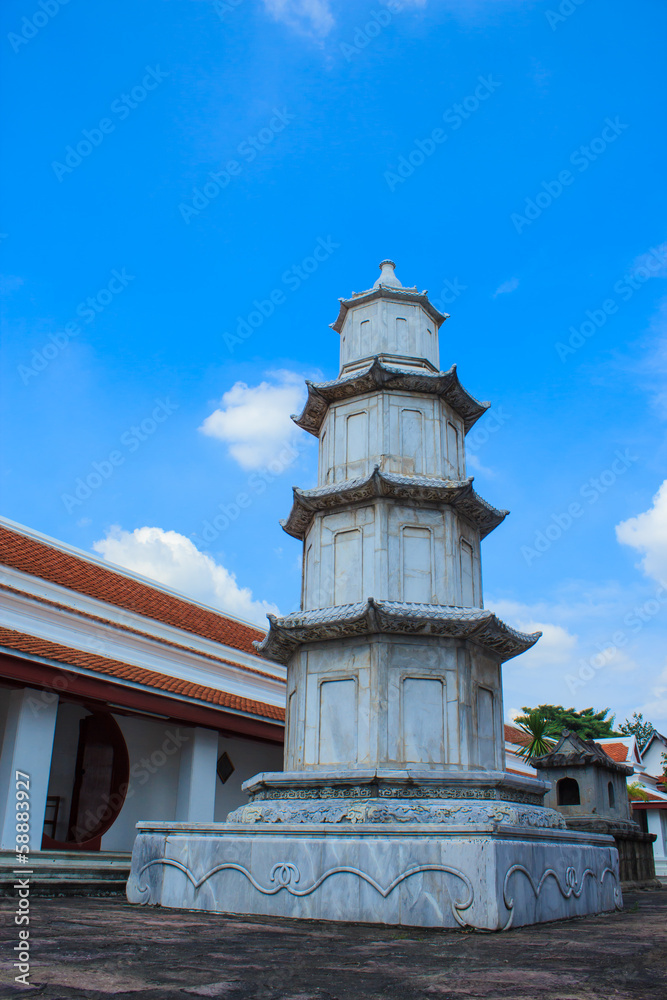 White stone pagoda on blue sky