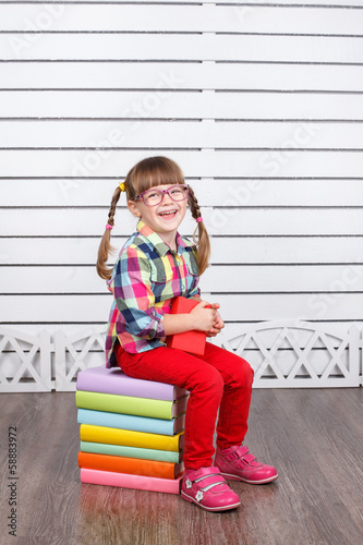 Girl in glasses with books