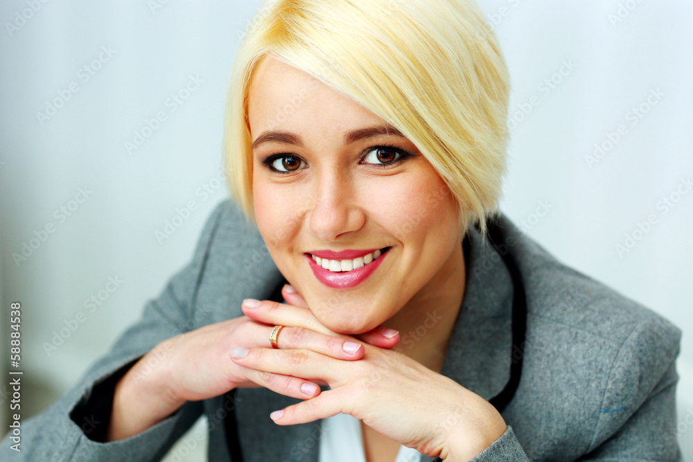 Closeup portrait of a cheerful businesswoman at office Closeup portrait of a cheerful businesswoman at office