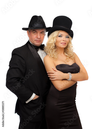 Man and woman in elegant suits and hats .. © oshepkov