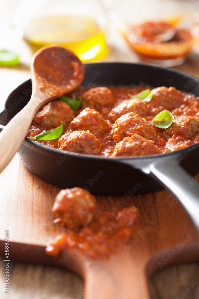 meatballs with tomato sauce in black pan