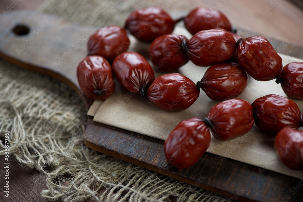 Obraz premium Meat products: smoked mini sausages