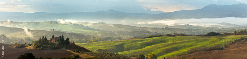 Val d'Orcia on a misty morning. Tuscany. Italy. Panorama