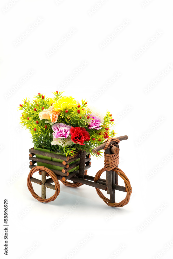 Wooden bicycle with colorful flowers on white