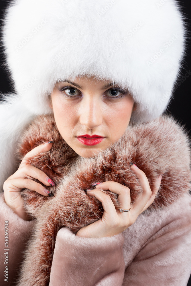 Portrait of beautiful young woman in fur hat Portrait of beautiful young woman in fur hat