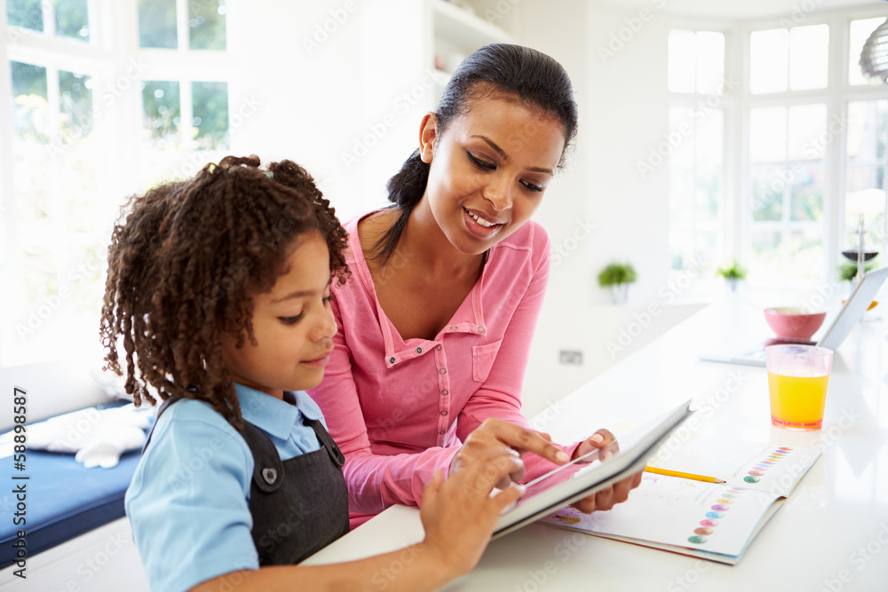Mother And Child Using Digital Tablet For Homework Mother And Child Using Digital Tablet For Homework