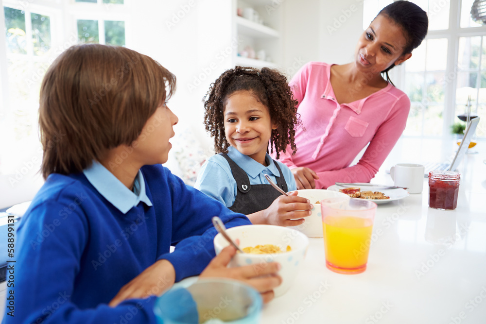 Mother And Children Having Breakfast Before School Mother And Children Having Breakfast Before School