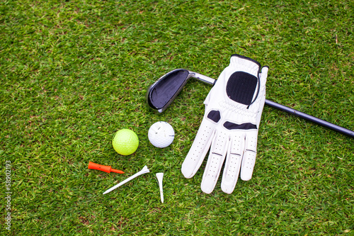 Fotografie Golf equipment on green grass