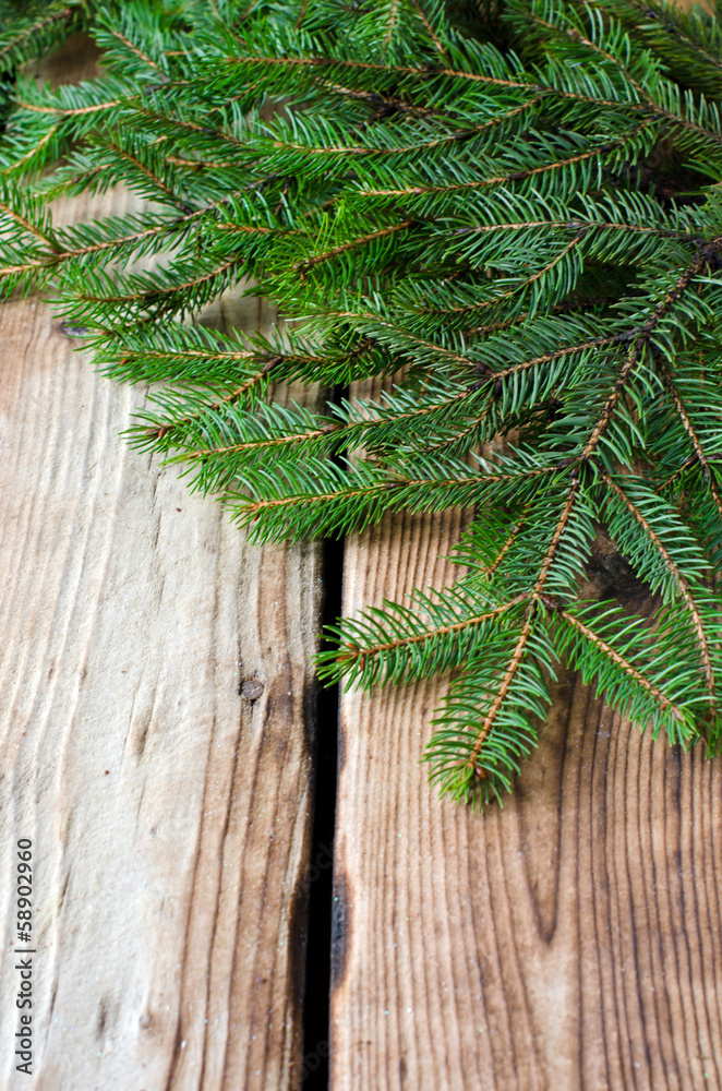 Fir branches on a wooden table Fir branches on a wooden table