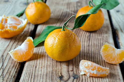 Fresh tangerine on a wooden table