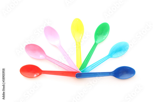 multicolor plastic spoons on white background © Ratana21