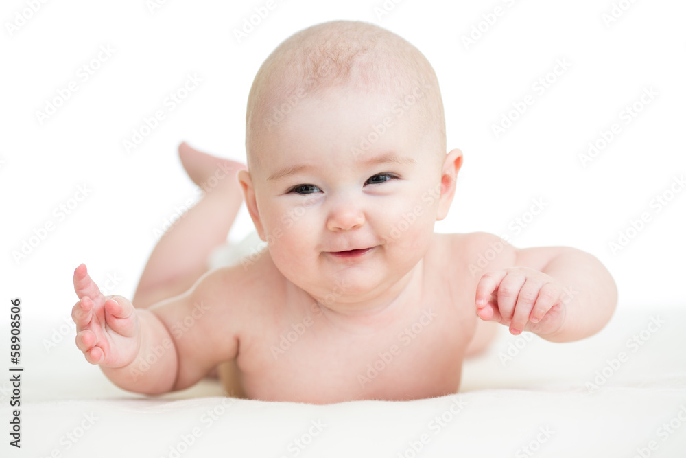 Baby boy isolated lying smilingly Baby boy isolated lying smilingly