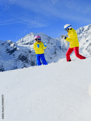 Ski, sun and winter fun - skiers enjoying winter