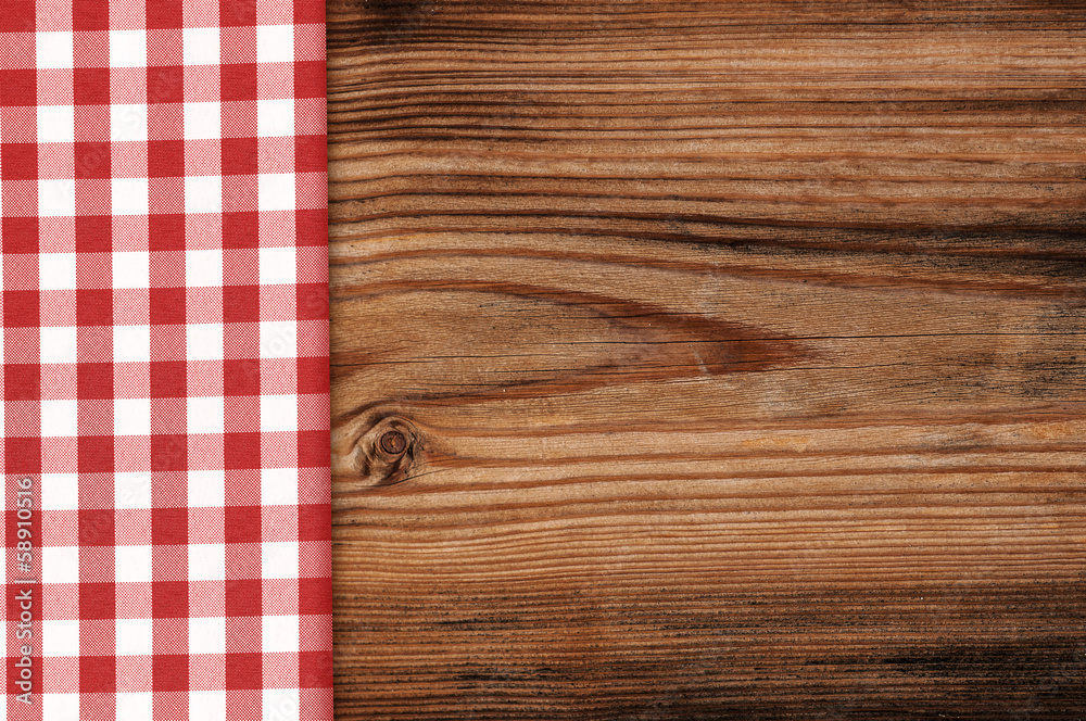 Tablecloth on wooden table background