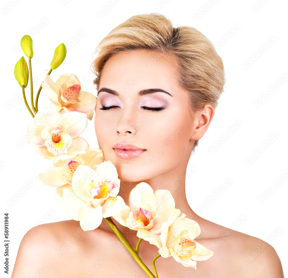 Beautiful face of woman with healthy skin and pink flowers Beautiful face of woman with healthy skin and pink flowers