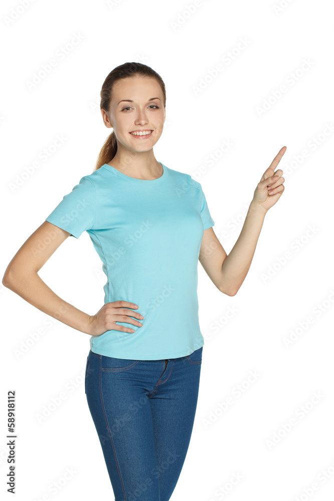 Young girl stands and points.