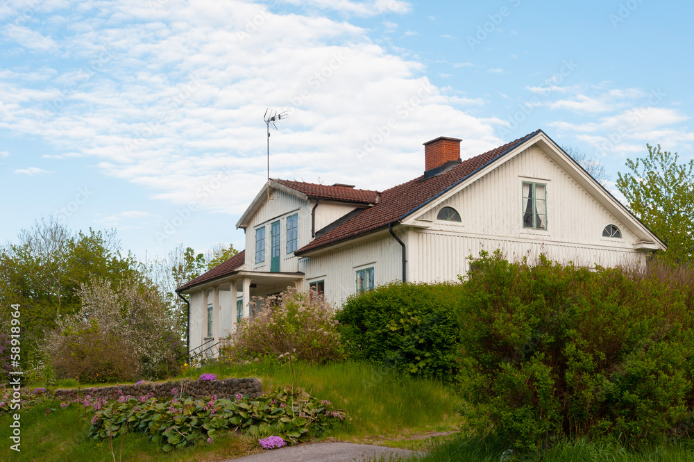 White wooden cottage, Sweden