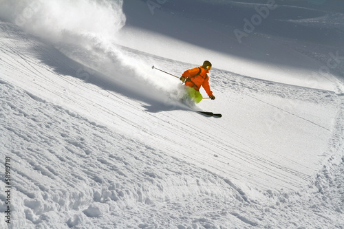 Skier in deep powder, extreme freeride