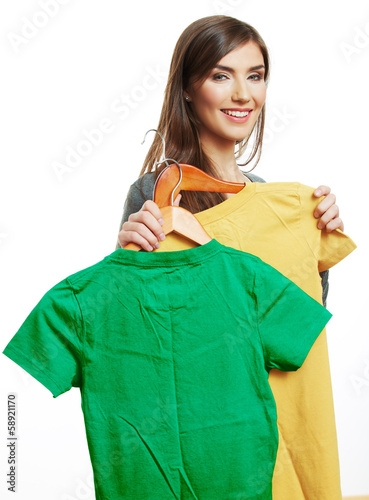 Woman holding casual clothes.