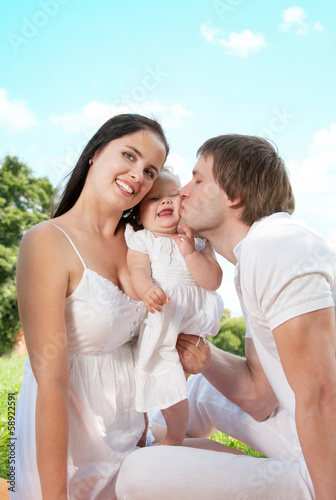 Happy Family picnicking in the park