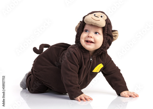 Photography Cute baby boy in monkey costume looking up over white