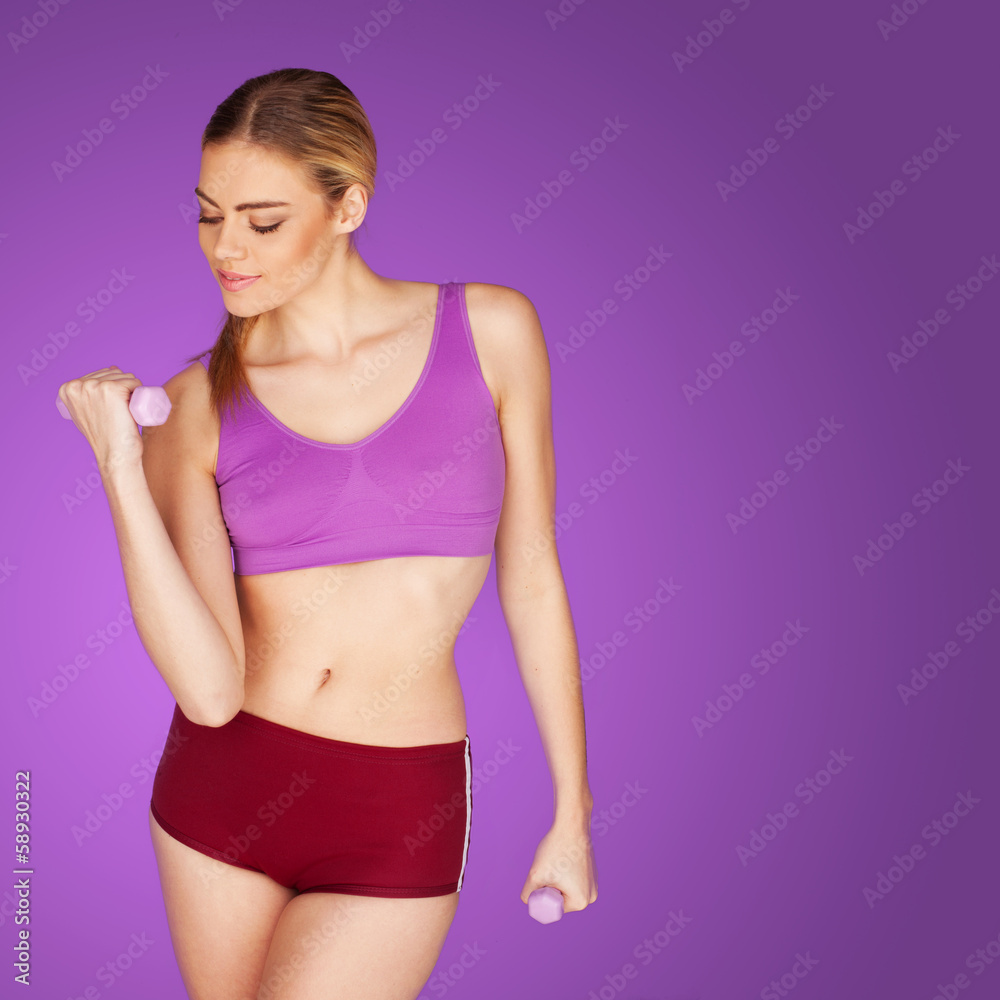 attractive woman exercising with dumbbell attractive woman exercising with dumbbell