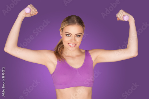 attractive woman exercising with dumbbell