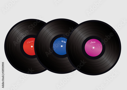 three vinyls with colorful labels