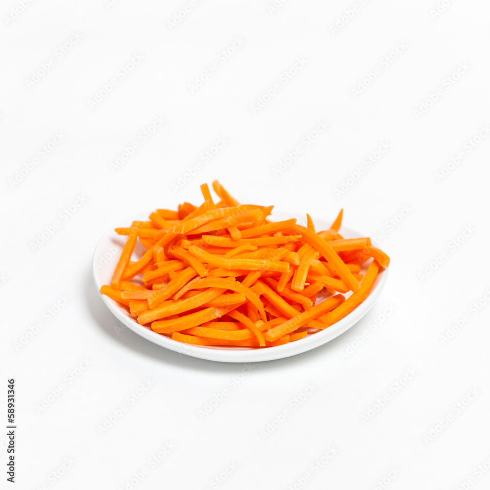 Freshly shredded carrots in small dish Freshly shredded carrots in small dish