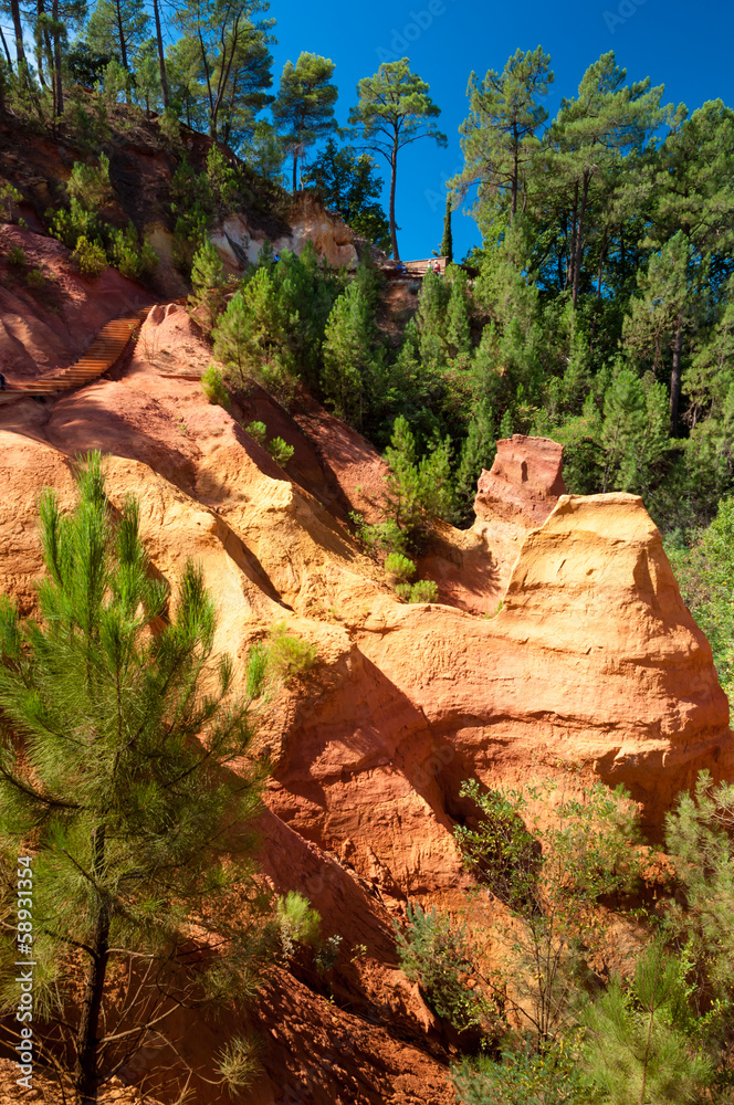 Rock formations and woods on Le Sentier des Ocres in Roussillon