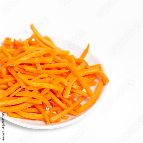 Freshly shredded carrots in small dish