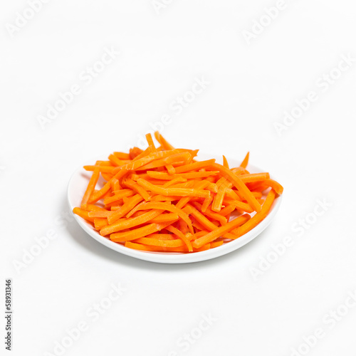 Freshly shredded carrots in small dish