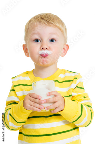 Funny kid drinking milk fro...