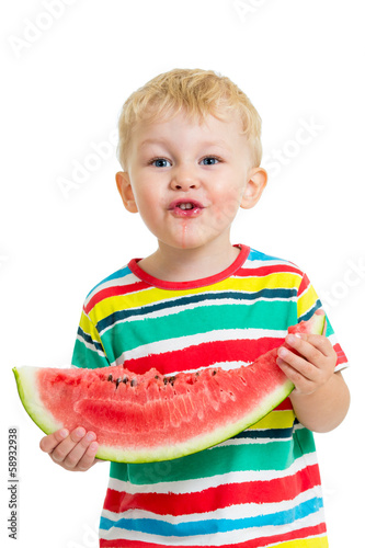Child boy eating watermelon...