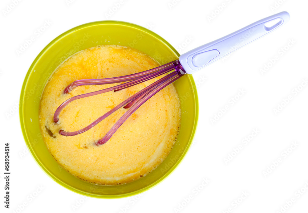 Corolla and broken eggs in bowl isolated on white Corolla and broken eggs in bowl isolated on white