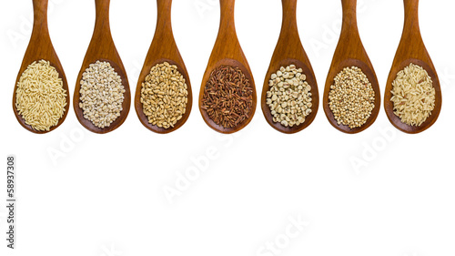 collection of grains in wooden spoon