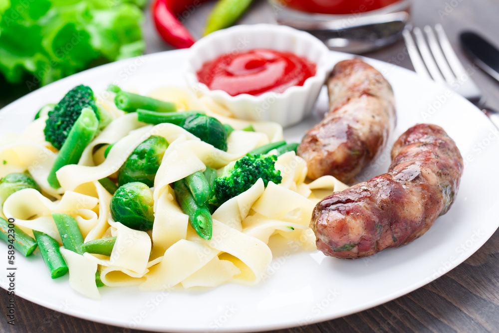 Fettuccine with vegetables and fried sausages Fettuccine with vegetables and fried sausages