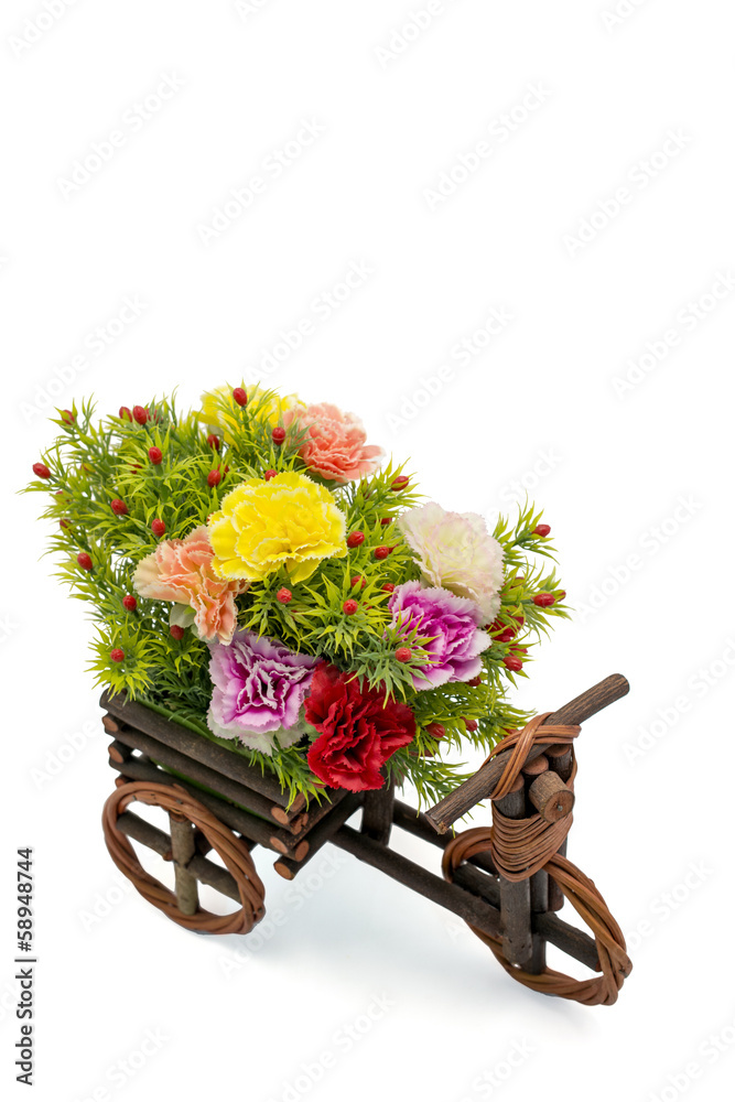 Wooden bicycle with colorful flowers on white