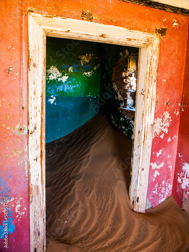 Sand in abandoned house in Kolmanskop ghost town photo