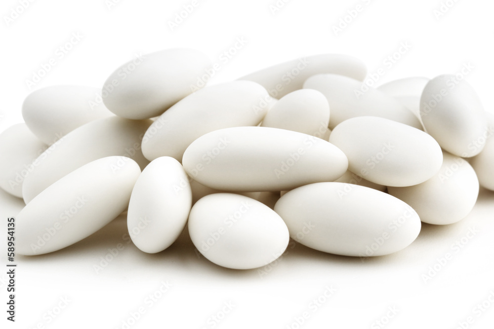 heap of white sugared almonds heap of white sugared almonds