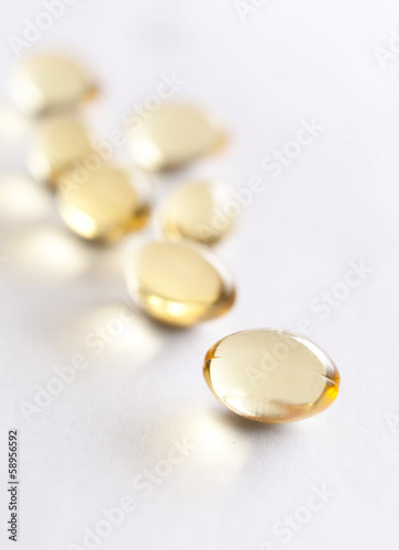 Close up of vitamins in capsules, isolated on white