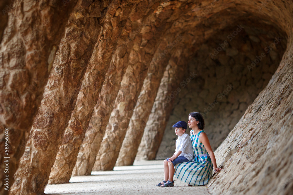 Young mother and her son walking Park Guell Young mother and her son walking Park Guell