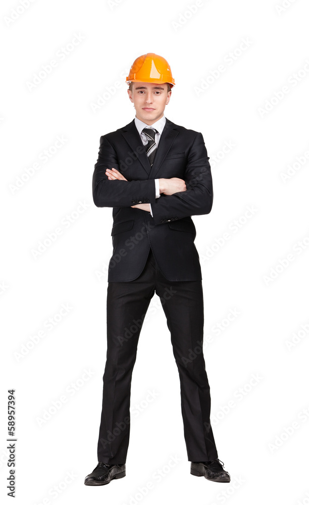 Portrait of businessman with arms crossed in hard hat 