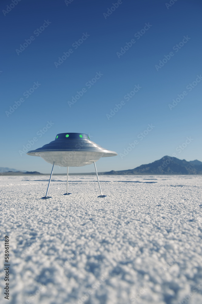 Fototapeta premium Silver Metal Flying Saucer UFO Harsh White Desert Planet